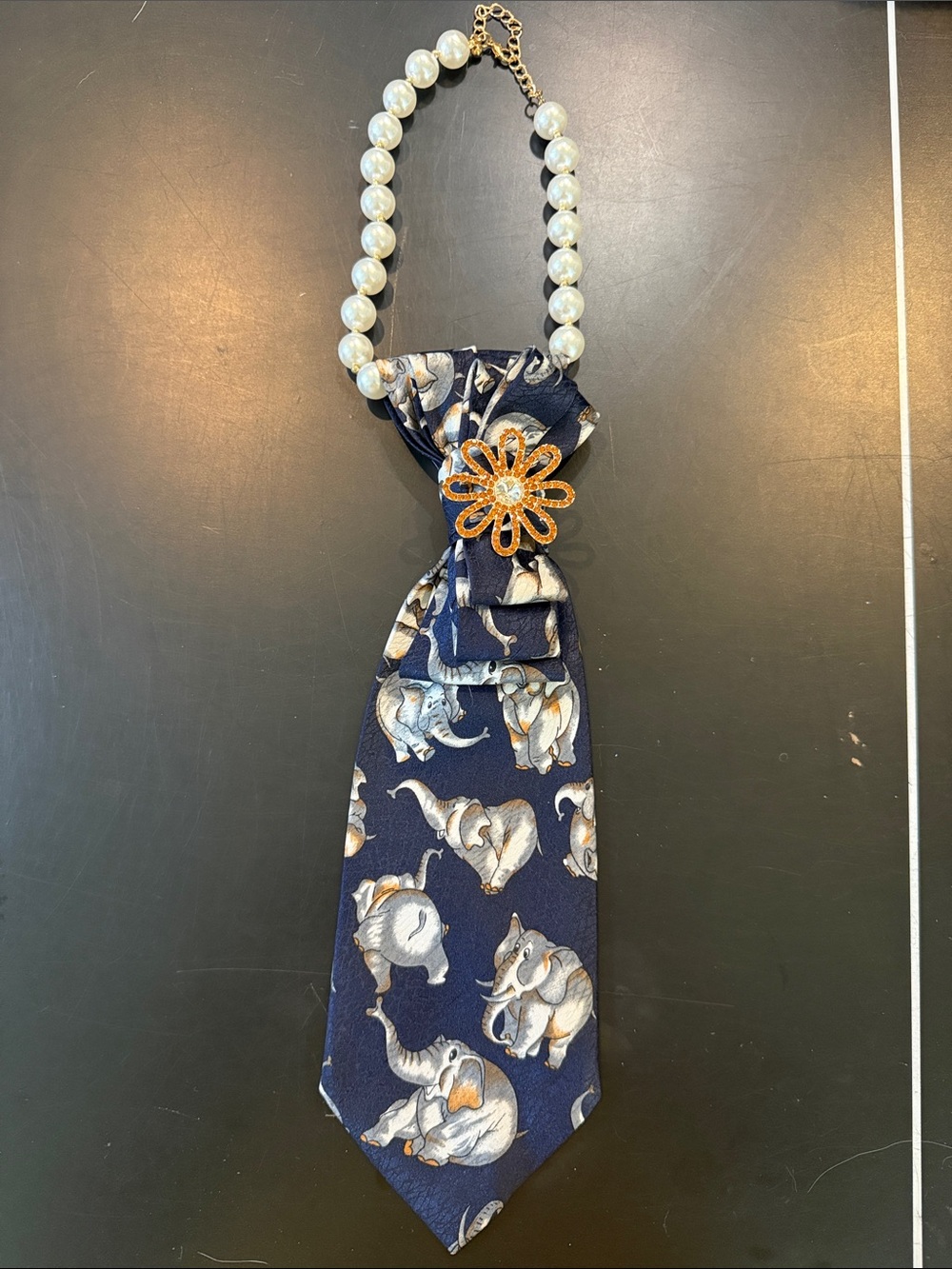 SellersMerch Navy Elephant Print Pearl Tie Necklace with Gold Flower Accent